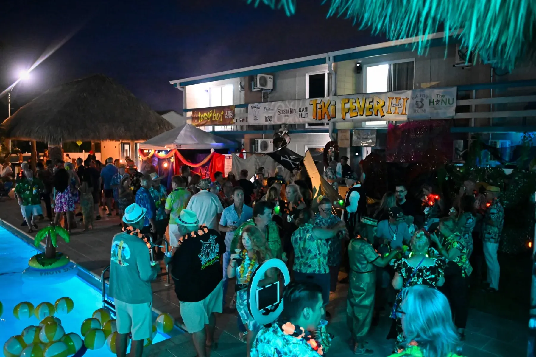 Guests enjoy a themed room crawl during Tiki Fever